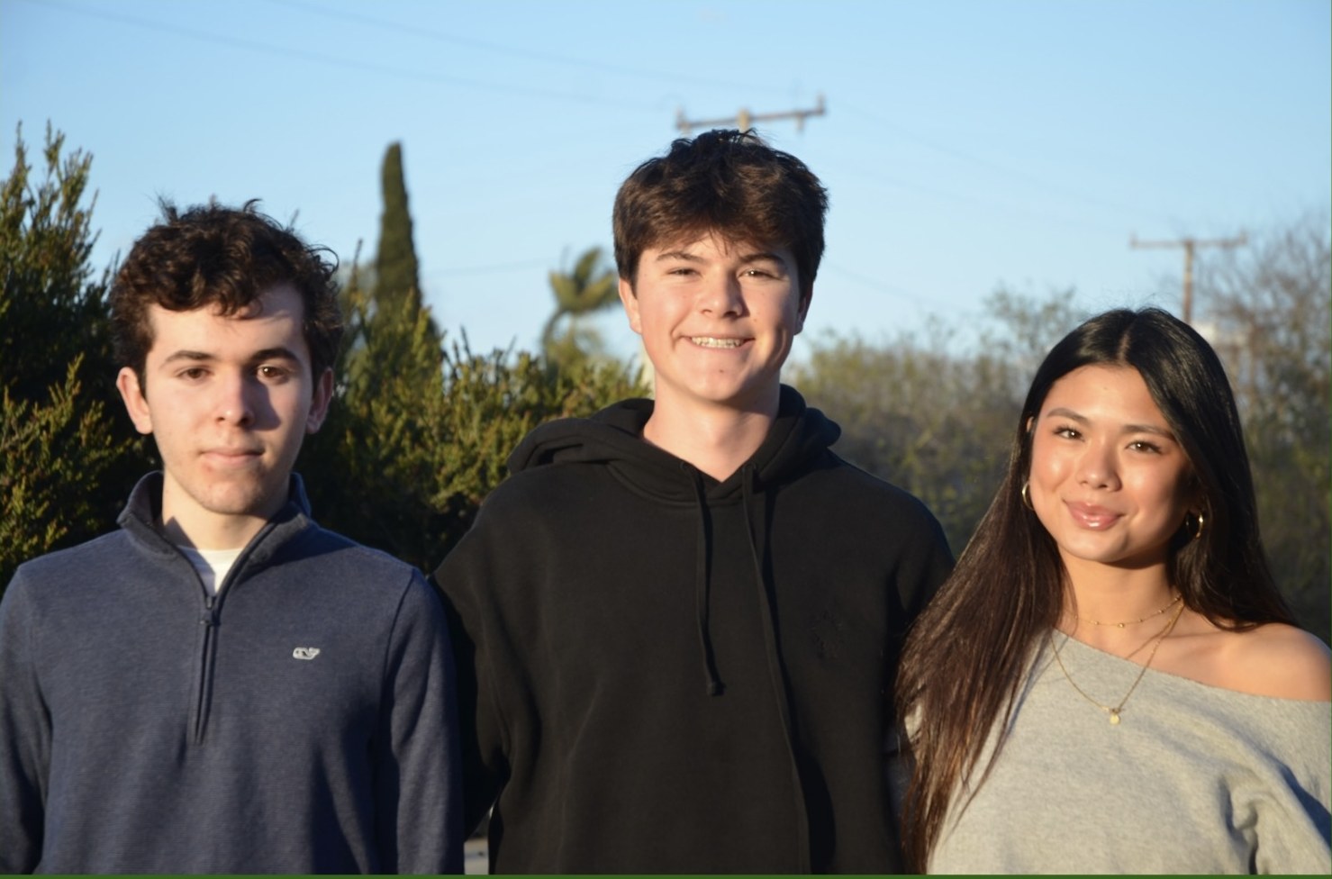 Antonio Cunha, Thomas Edwards and Manuela Barros standing outdoors